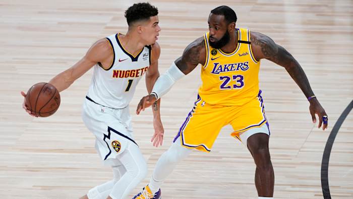 Los Angeles Lakers' LeBron James pressures Denver Nuggets' Michael Porter Jr.